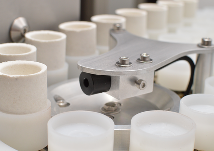 Autoloader with acid-resistant plastic crucible holders